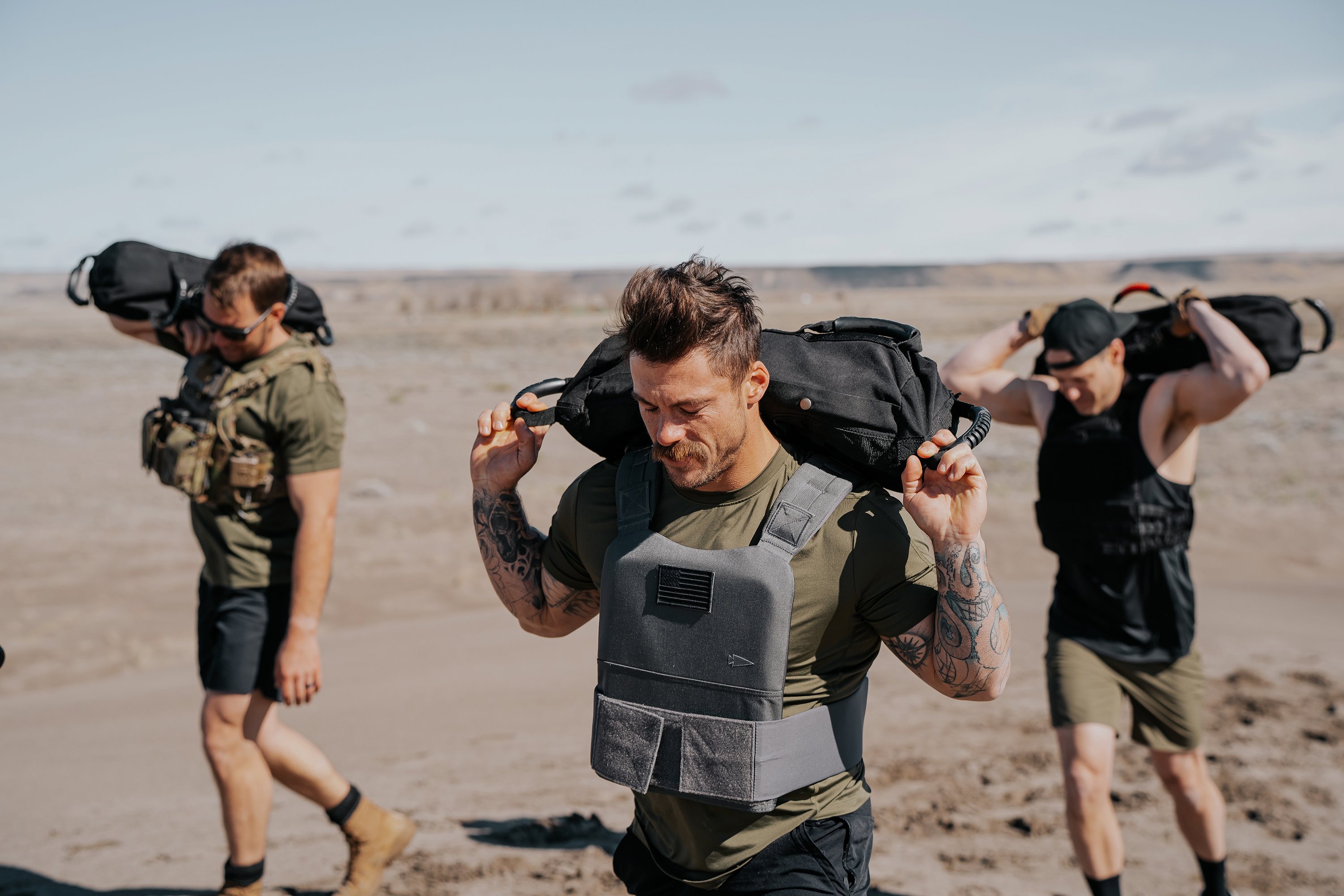 LINEAR Clothing models wearing Baseline Series Tank and walking in sand dunes