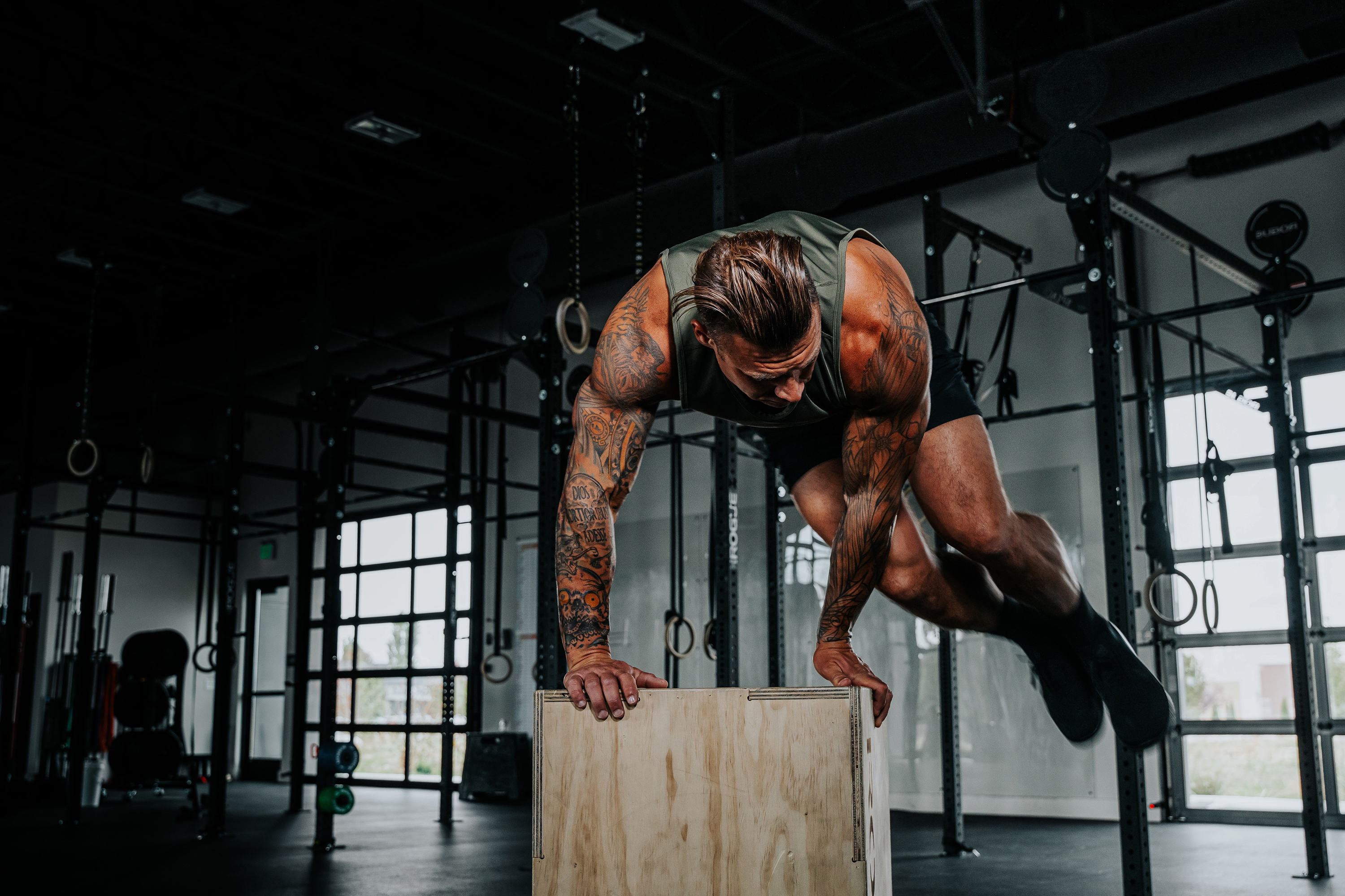 LINEAR Clothing Athlete performing box jumps in the gym